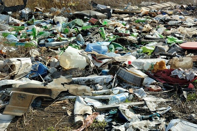 humans polluting the planet with uncontrolled rubbish dumping - major environmental problems